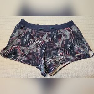 Patagonia Nine Trails Women’s running shorts Size Large Navy Blue Print